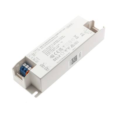 Primer plano de un controlador de potencia LED blanco rectangular con conectores, texto etiquetado y símbolos para mejorar la eficiencia energética de la iluminación LED.