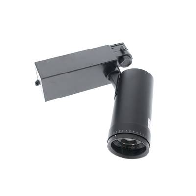 Moderna lámpara de riel negro con una lámpara cilíndrica sobre una base rectangular, en diagonal sobre un fondo blanco en ángulo para una solución de iluminación con estilo.