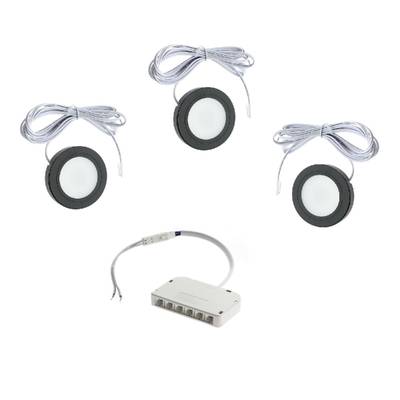 Kit de iluminación LED con lámparas redondas, cables de conexión y fuente de alimentación multipuerto.