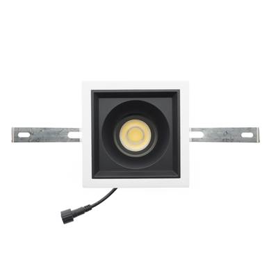Downlight LED rectangular empotrable con tira decorativa blanca, bombilla central, soportes de montaje y cable de alimentación negro lateral. Ideal para soluciones de iluminación contemporáneas.