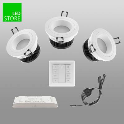 Imagen de tres luces LED circulares con mando a distancia, cableado y caja de control sobre fondo gris; logotipo "LED STORE" verde en la esquina. Perfecto para sus necesidades de iluminación.