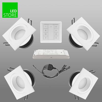 Kit de downlight LED: cuatro luces cuadradas, mando a distancia, fuente de alimentación. Pegatina verde "LED Store" en la esquina superior izquierda para una iluminación respetuosa con el medio ambiente.