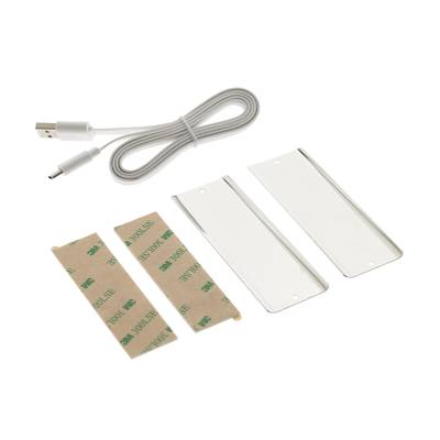 Kit de instalación de iluminación LED: cable USB, tiras adhesivas y piezas rectangulares de plástico blanco con fondo blanco.