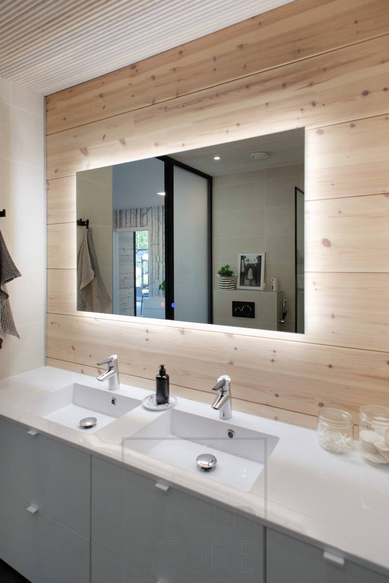 El gran espejo con luz HALO proporciona una iluminación eficaz a través de la pared y añade espacio al cuarto de baño. Ledstore.fi