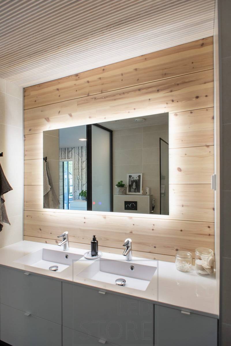 El gran espejo con luz HALO proporciona una iluminación eficaz a través de la pared y añade espacio al cuarto de baño. Ledstore.fi