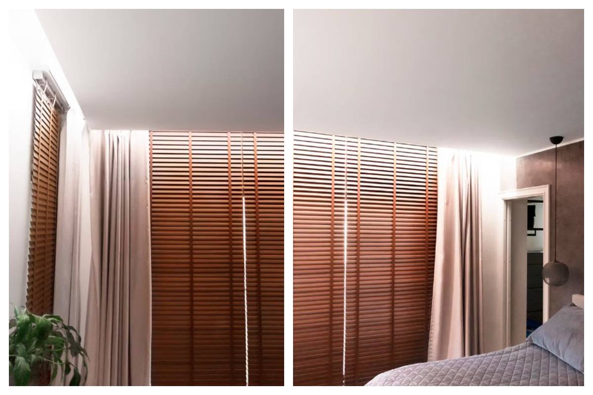 Un dormitorio moderno en Kaitamäki, Espoo: persianas de madera, cortinas beige, vegetación y una cama bien hecha crean la atmósfera de un apacible hogar familiar. El conjunto se complementa con la iluminación LED cuidadosamente diseñada por LedStore.fi, que acentúa el carácter acogedor y el estilo del espacio.